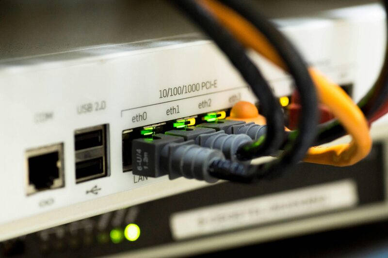 Every one of those links can have its own /64, and every device behind them a real, globally routable address. That is the part IPv4 cannot give you anymore. A small router with its gigabit ethernet ports lit up green